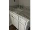 Bathroom vanity featuring grey and white granite countertop and white cabinets at 1081 Irving Manigault Rd, McClellanville, SC 29458
