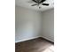 An unfurnished bedroom featuring a ceiling fan and wood-look flooring at 1081 Irving Manigault Rd, McClellanville, SC 29458