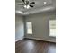 Newly painted bedroom with two windows, and wood-look flooring at 1081 Irving Manigault Rd, McClellanville, SC 29458