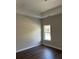 Bedroom with hardwood flooring and large windows, lots of natural light at 1081 Irving Manigault Rd, McClellanville, SC 29458