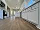 Spacious kitchen with white cabinetry, stainless steel appliances, marble countertops, and modern lighting at 1081 Irving Manigault Rd, McClellanville, SC 29458