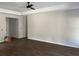 Spacious living room with new hardwood floor and ceiling fan at 1081 Irving Manigault Rd, McClellanville, SC 29458