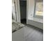 Bathroom showcasing a tub with shower, vanity with sink, and walk-in closet at 1085 Irving Manigault Rd, McClellanville, SC 29458