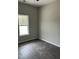 Bedroom featuring dark flooring and a window for natural light at 1085 Irving Manigault Rd, McClellanville, SC 29458