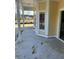 Exterior view of a home's covered porch and bay window, featuring yellow siding and white trim at 1085 Irving Manigault Rd, McClellanville, SC 29458