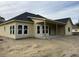 New home with rear covered patio and large windows at 1085 Irving Manigault Rd, McClellanville, SC 29458