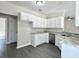 Kitchen featuring white cabinets, granite countertops, stainless appliances, and vinyl flooring at 1085 Irving Manigault Rd, McClellanville, SC 29458