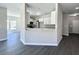Beautiful kitchen area features white cabinets, stainless appliances, and vinyl flooring at 1085 Irving Manigault Rd, McClellanville, SC 29458