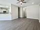 Open concept living area with vinyl floors, recessed lighting, and view into the kitchen at 1085 Irving Manigault Rd, McClellanville, SC 29458