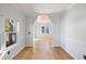 Dining room with hardwood floors, chair rail molding, and arched entryway at 1235 Wild Olive Dr, Mount Pleasant, SC 29464