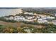 Aerial view of community near water, featuring apartments and landscaping at 130 River Landing Dr # 8203, Charleston, SC 29492