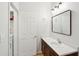 Small bathroom with a single sink, linen closet, and wood vanity at 130 River Landing Dr # 8203, Charleston, SC 29492