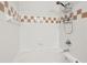 Bathroom features a shower/tub combo and tiled walls at 130 River Landing Dr # 8203, Charleston, SC 29492
