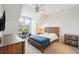 Bedroom with rustic wood bed frame and a large window at 130 River Landing Dr # 8203, Charleston, SC 29492