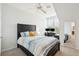 Bedroom with a queen bed, desk, and large window at 130 River Landing Dr # 8203, Charleston, SC 29492