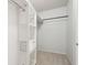 Spacious closet with built-in shelves and hanging rod at 130 River Landing Dr # 8203, Charleston, SC 29492
