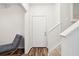 Bright entryway with stairs, hardwood floors, and a chair at 130 River Landing Dr # 8203, Charleston, SC 29492