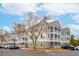 Three-story apartment building with balconies and ample parking at 130 River Landing Dr # 8203, Charleston, SC 29492