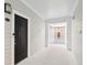 Apartment entry hallway with dark door and fire extinguisher at 130 River Landing Dr # 8203, Charleston, SC 29492