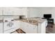 White kitchen with granite countertops and stainless steel appliances at 130 River Landing Dr # 8203, Charleston, SC 29492