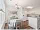 White kitchen features stainless steel appliances and granite countertops at 130 River Landing Dr # 8203, Charleston, SC 29492