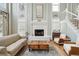 Elegant living room with a fireplace, hardwood floors, and high ceilings at 130 River Landing Dr # 8203, Charleston, SC 29492