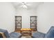 Small office space with two armchairs and built-in shelving at 130 River Landing Dr # 8203, Charleston, SC 29492