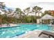 Resort-style swimming pool with plenty of lounge chairs at 130 River Landing Dr # 8203, Charleston, SC 29492