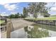 Concrete boat ramp leading to calm waters at 1401 Churchill Rd, Moncks Corner, SC 29461