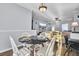 Casual dining area with a round table, four chairs, and view into living room at 1401 Churchill Rd, Moncks Corner, SC 29461