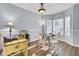 Bright dining area with hardwood floors and a charming table for four at 1401 Churchill Rd, Moncks Corner, SC 29461