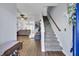 Bright entryway with gray carpeting and view of living room at 1401 Churchill Rd, Moncks Corner, SC 29461