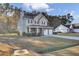 Two-story house with brick and siding, two-car garage, and a porch at 1401 Churchill Rd, Moncks Corner, SC 29461