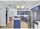 Modern kitchen with blue cabinets, stainless steel appliances and an island at 1401 Churchill Rd, Moncks Corner, SC 29461