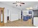 Open concept kitchen with island, blue cabinets and stainless steel appliances at 1401 Churchill Rd, Moncks Corner, SC 29461