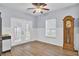 Bright kitchen with blue cabinets, stainless steel appliances, and french doors at 1401 Churchill Rd, Moncks Corner, SC 29461