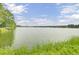 Serene lakefront view with calm waters at 1401 Churchill Rd, Moncks Corner, SC 29461