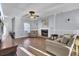 Living room with hardwood floors, fireplace, and neutral decor at 1401 Churchill Rd, Moncks Corner, SC 29461