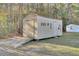 Beige metal storage shed with double doors and ramp at 1401 Churchill Rd, Moncks Corner, SC 29461