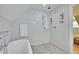 Spa-like bathroom with soaking tub and pebble floor at 15 Horlbeck Aly # A-7, Charleston, SC 29401