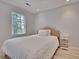 Cozy bedroom with a queen bed and nightstand at 15 Horlbeck Aly # A-7, Charleston, SC 29401