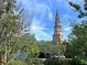 Historic church with tall steeple and lush greenery at 15 Horlbeck Aly # A-7, Charleston, SC 29401
