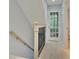 Upstairs hallway with light wood floors and a staircase at 15 Horlbeck Aly # A-7, Charleston, SC 29401
