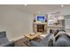 Open living space with fireplace, sofas, and view into kitchen area at 15 Horlbeck Aly # A-7, Charleston, SC 29401