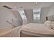 Large main bedroom with a king bed and upper loft area at 15 Horlbeck Aly # A-7, Charleston, SC 29401