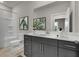 Bathroom with shower/tub combo and dark vanity at 2018 Quiet Ibis Rd, Hanahan, SC 29410