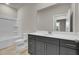 Bathroom with a shower/tub combo and dark vanity at 2018 Quiet Ibis Rd, Hanahan, SC 29410