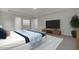 Main bedroom with a large TV and stylish decor at 2018 Quiet Ibis Rd, Hanahan, SC 29410