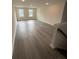 Large bonus room featuring hardwood floors and two windows at 2018 Quiet Ibis Rd, Hanahan, SC 29410
