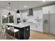 Modern kitchen with white cabinets, quartz countertops, and large island with seating at 2018 Quiet Ibis Rd, Hanahan, SC 29410